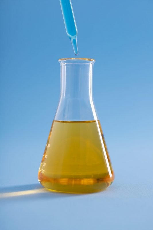 vertical closeup dropper with blue liquid erlenmeyer flask yellow liquid blue surface scaled e1666199293110 533x800 1